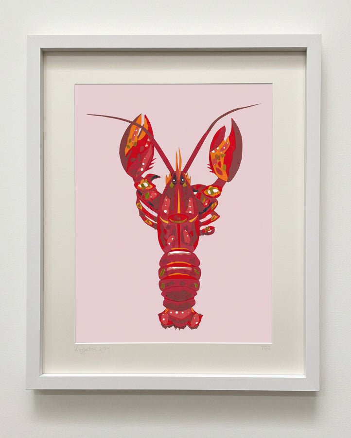 Framed artwork of a red lobster on a pink background