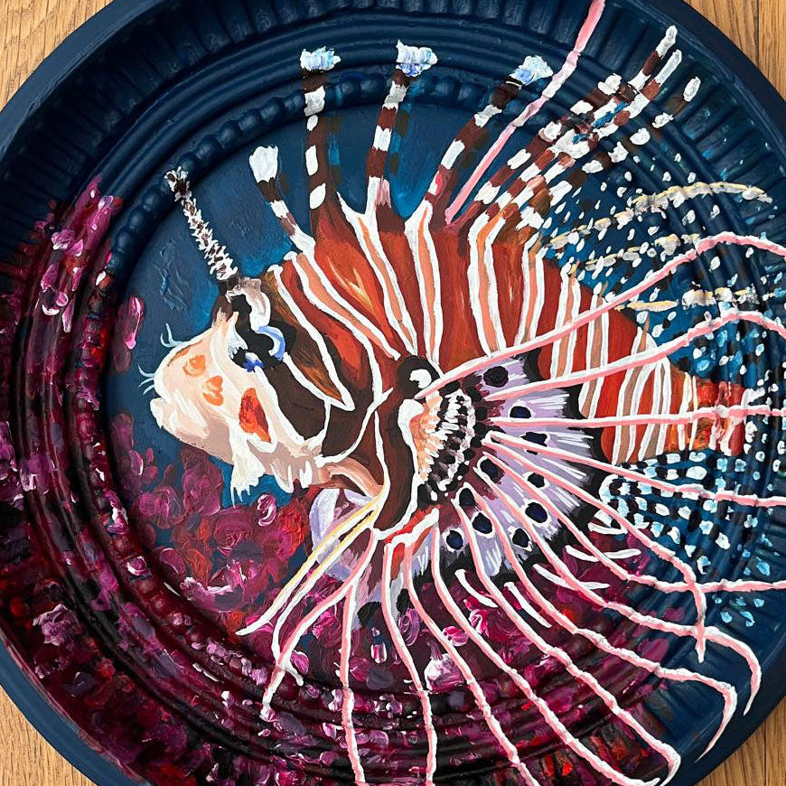 Decorative frame with a lionfish design.