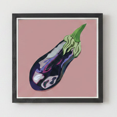 Framed artwork of an aubergine on a pink background