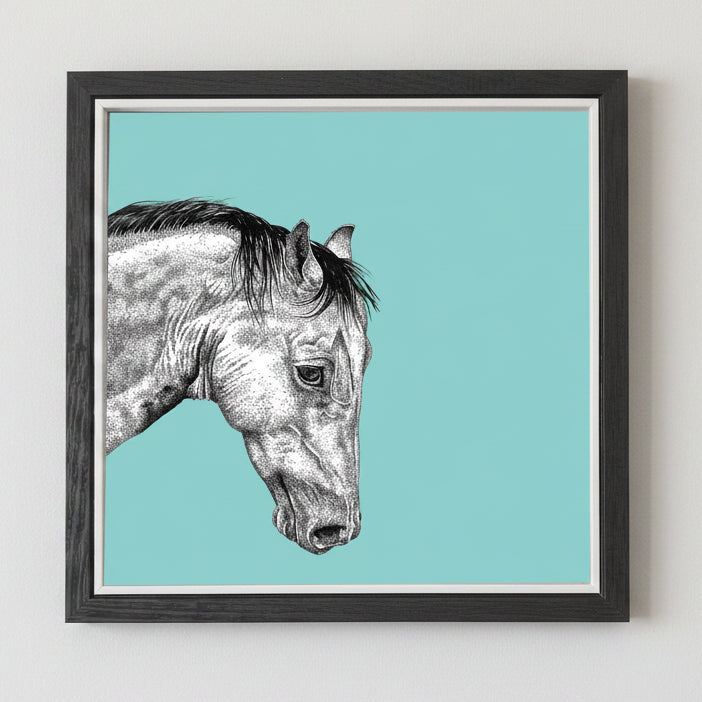 Framed artwork of a horse's head on a teal background