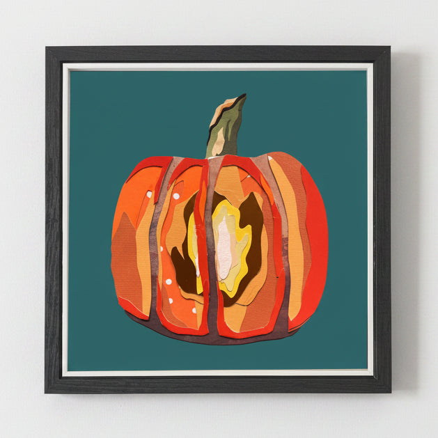 Framed artwork of a stylized pumpkin on a teal background