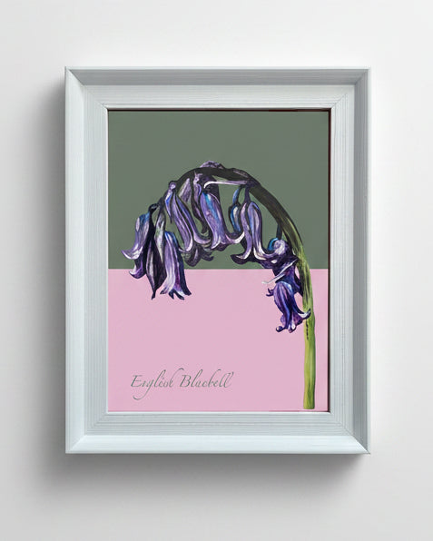 Framed artwork of an English bluebell on a wooden surface