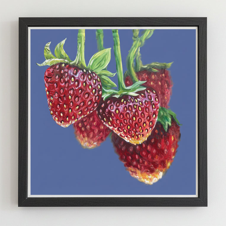Framed artwork of strawberries on a blue background